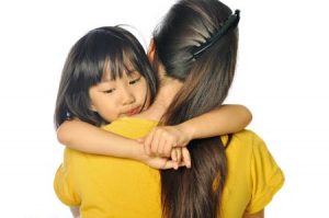 Anxious Child Hugging Mother